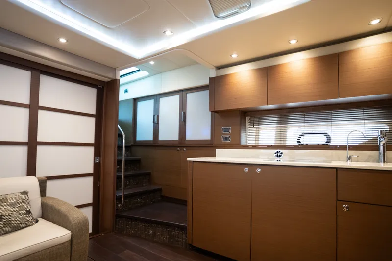 Slide: The Image of Luxurious interior of 2016 Sea Ray Sundancer 540 yacht with modern kitchen and staircase. - 58