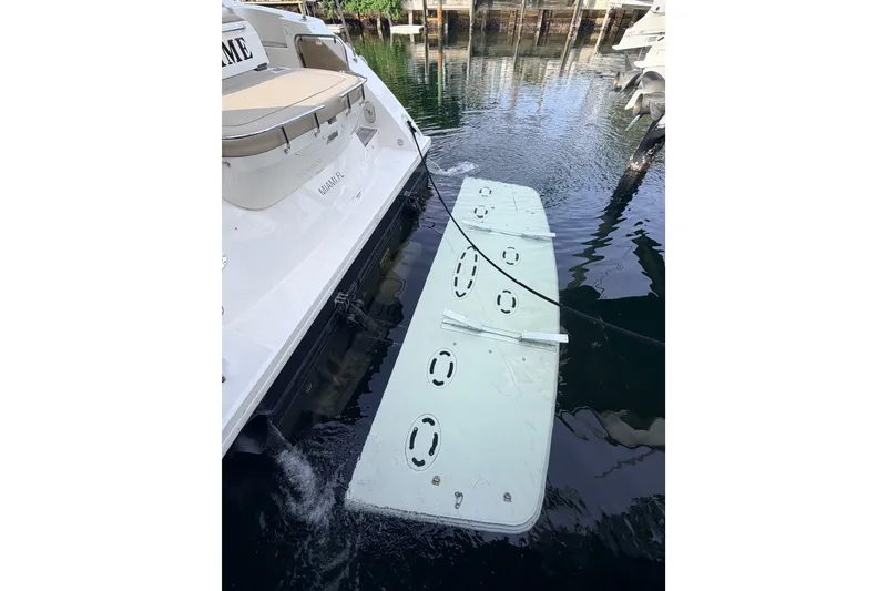 Slide: The Image of 2016 Sea Ray Sundancer 540 yacht with swim platform in water. - 53