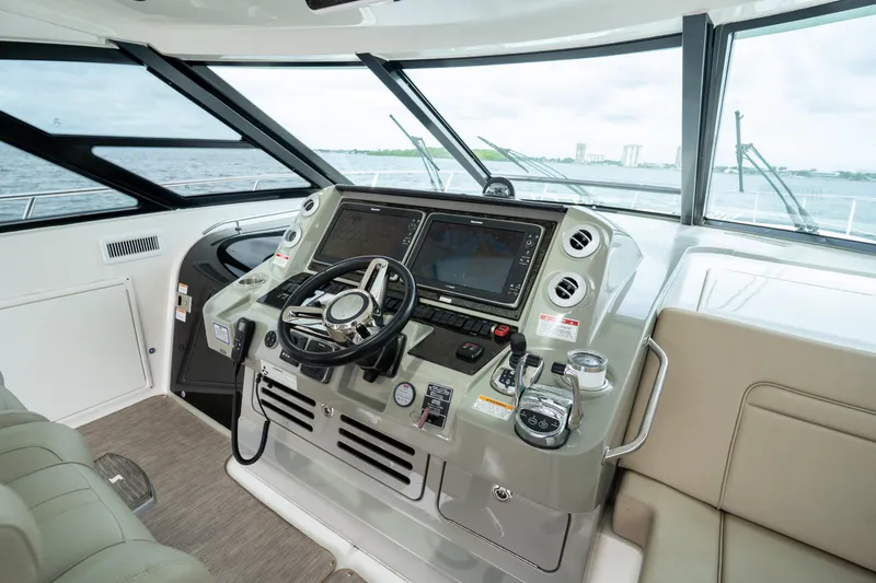 Slide: The Image of Helm of 2016 Sea Ray Sundancer 540 yacht with modern navigation equipment. - 27