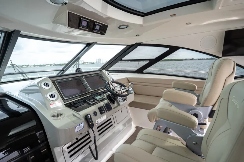Slide: The Image of Luxurious 2016 Sea Ray Sundancer 540 helm with advanced navigation systems and plush seating. - 34