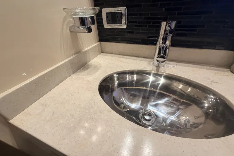 Slide: The Image of Luxurious bathroom sink in 2016 Sea Ray Sundancer 540 yacht, featuring modern chrome fixtures. - 84
