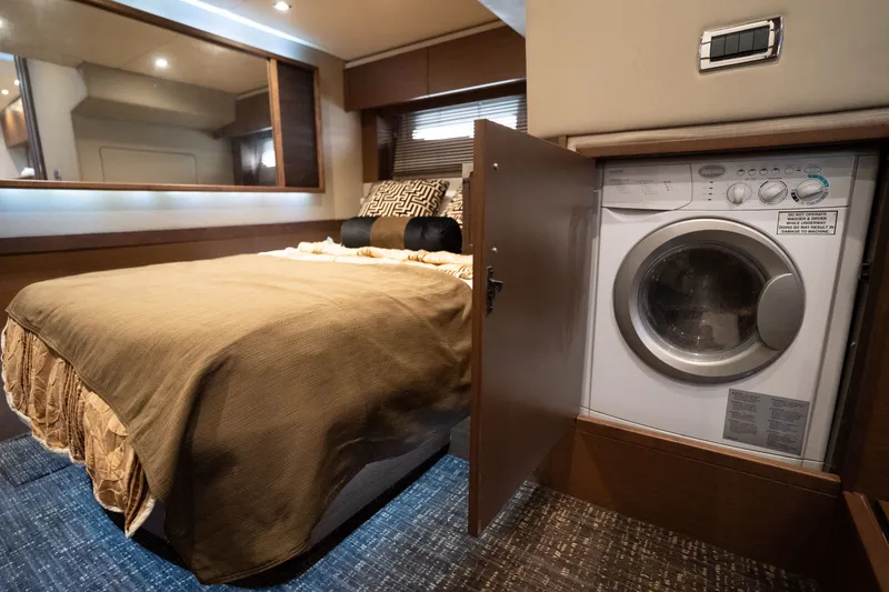 Slide: The Image of Luxurious 2016 Sea Ray Sundancer 540 cabin with bed and built-in washer. - 87