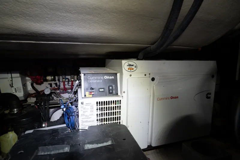 Slide: The Image of Engine room of 2016 Sea Ray Sundancer 540 with Cummins Onan generator. - 92