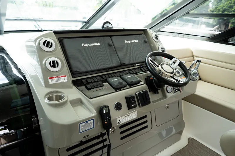 Slide: The Image of Helm of 2016 Sea Ray Sundancer 540 with Raymarine navigation system and modern controls. - 23