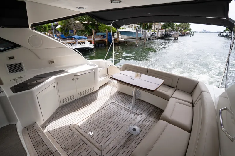 Slide: The Image of Luxurious 2016 Sea Ray Sundancer 540 yacht interior with elegant seating and waterfront view. - 38