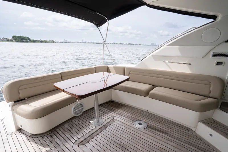 Slide: The Image of Luxurious 2016 Sea Ray Sundancer 540 yacht with elegant seating and scenic ocean view. - 41