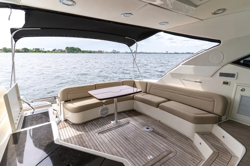 Slide: The Image of Luxurious 2016 Sea Ray Sundancer 540 yacht interior with elegant seating and scenic water view. - 39