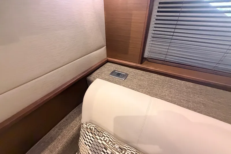 Slide: The Image of Interior of 2016 Sea Ray Sundancer 540 yacht with modern seating and window blinds. - 66