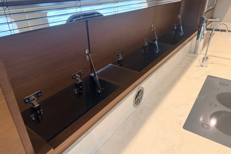 Slide: The Image of Luxurious kitchen area on a 2016 Sea Ray Sundancer 540 yacht, featuring modern fixtures. - 59
