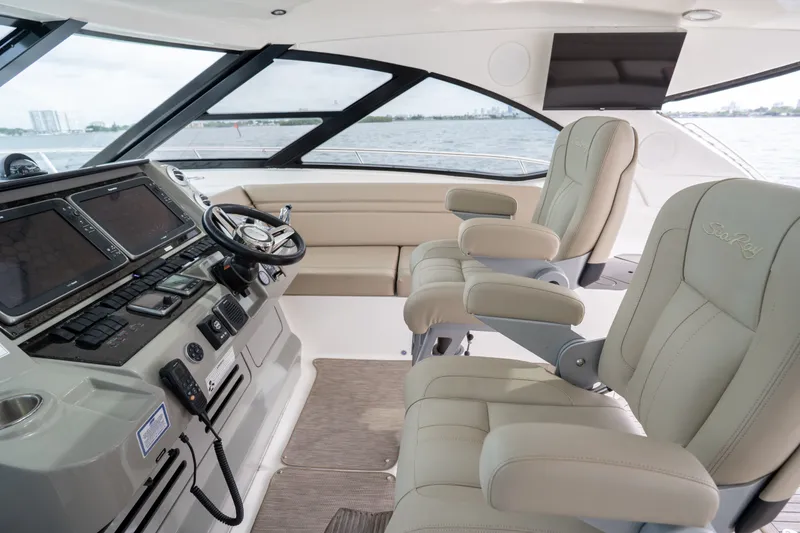 Slide: The Image of Luxurious 2016 Sea Ray Sundancer 540 helm with plush seating and advanced navigation controls. - 30