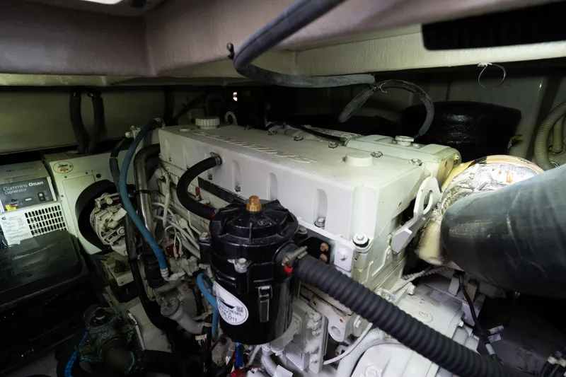 Slide: The Image of Engine room of 2016 Sea Ray Sundancer 540 yacht, featuring Cummins Onan generator. - 93