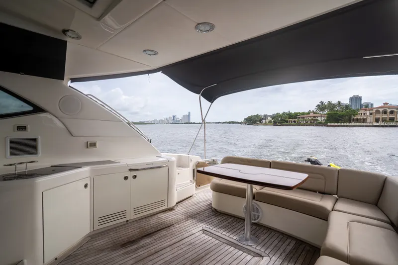 Slide: The Image of Luxurious 2016 Sea Ray Sundancer 540 yacht interior with waterfront view and elegant seating area. - 21