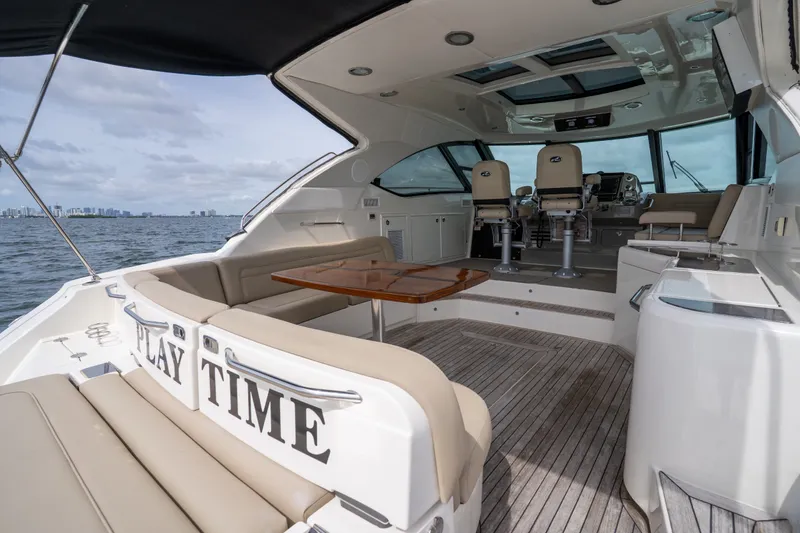Slide: The Image of Luxurious 2016 Sea Ray Sundancer 540 yacht interior with seating and helm, on open water. - 42