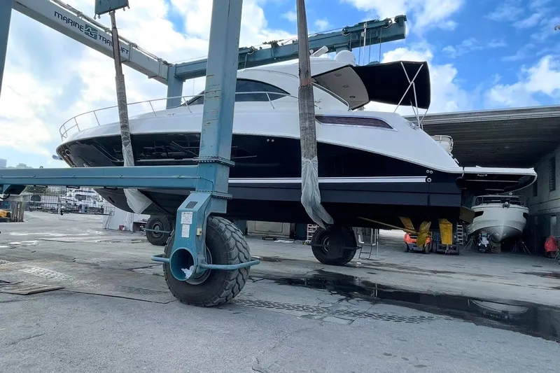 Slide: The Image of 2016 Sea Ray Sundancer 540 yacht on a lift at a marina. - 96