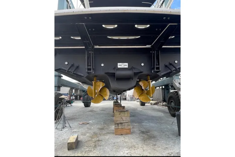 Slide: The Image of 2016 Sea Ray Sundancer 540 yacht propellers and hull on dry dock. - 100