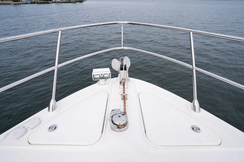 Slide: The Image of Bow view of 2016 Sea Ray Sundancer 540 yacht on calm water. - 15
