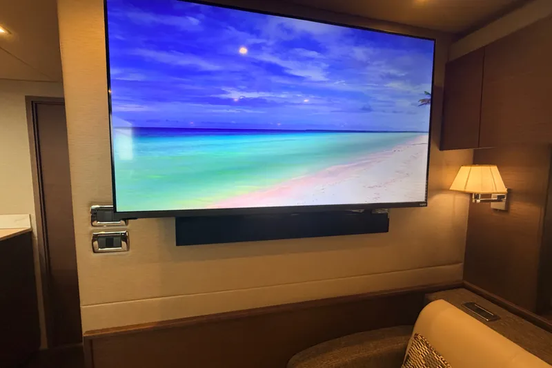 Slide: The Image of Luxurious interior of 2016 Sea Ray Sundancer 540 yacht with large TV and elegant lighting. - 67