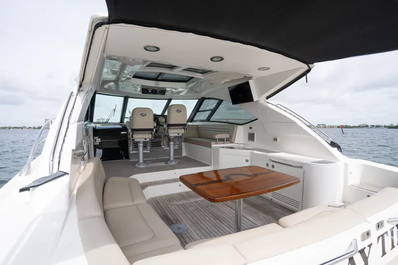 Slide: The Image of Luxurious 2016 Sea Ray Sundancer 540 yacht interior with seating and helm, on open water. - 44