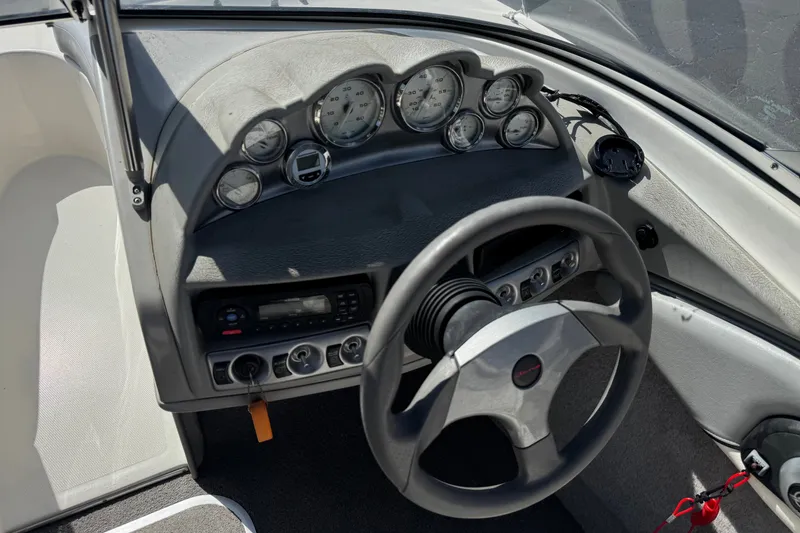 Slide: The Image of 2011 Bayliner 185 Bowrider dashboard with steering wheel and instrument panel. - 23