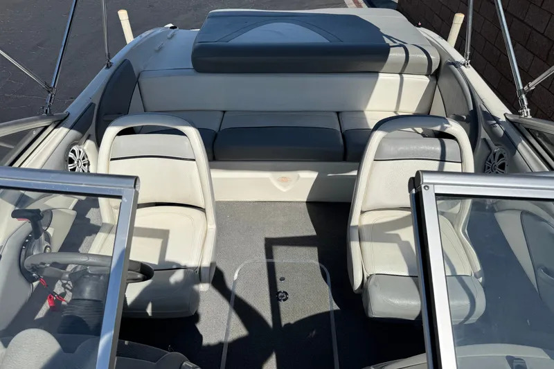 Slide: The Image of 2011 Bayliner 185 Bowrider interior with seating and steering wheel, showcasing spacious design. - 13