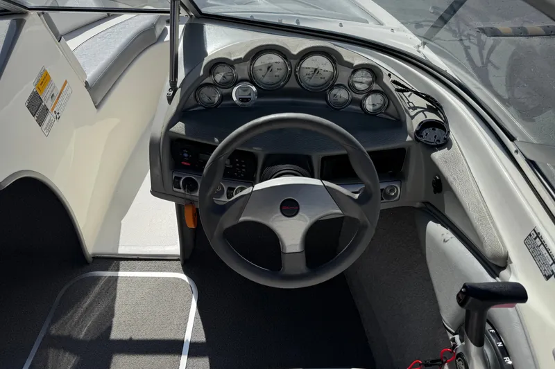 Slide: The Image of 2011 Bayliner 185 Bowrider dashboard with steering wheel and instrument panel. - 22