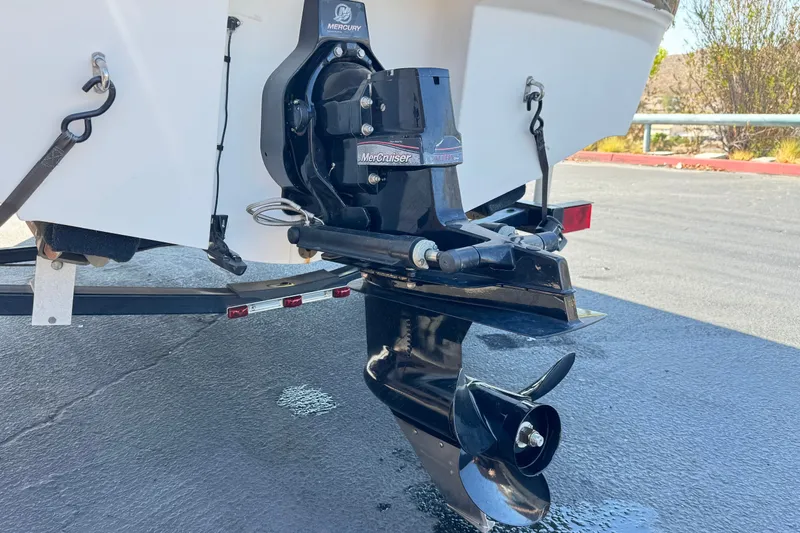 Slide: The Image of 2011 Bayliner 185 Bowrider with MerCruiser outboard motor on trailer. - 7