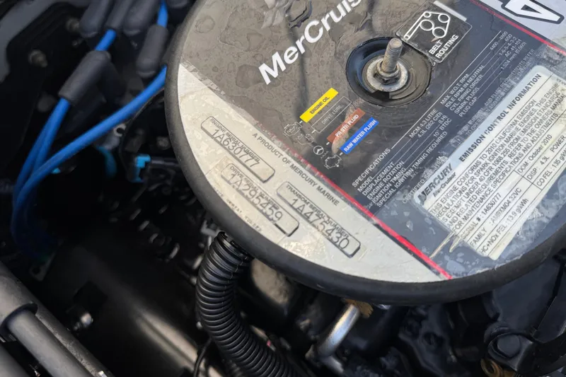 Slide: The Image of Engine compartment of a 2011 Bayliner 185 Bowrider with MerCruiser specifications. - 17
