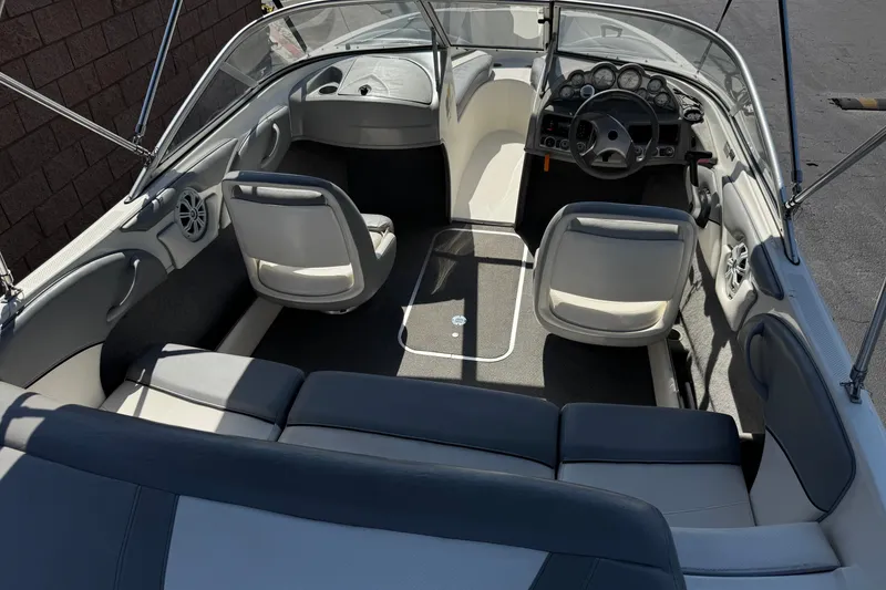 Slide: The Image of 2011 Bayliner 185 Bowrider interior with seating, steering wheel, and dashboard. - 8