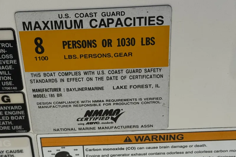 Slide: The Image of 2011 Bayliner 185 Bowrider capacity label, 8 persons or 1030 lbs, U.S. Coast Guard compliant. - 25