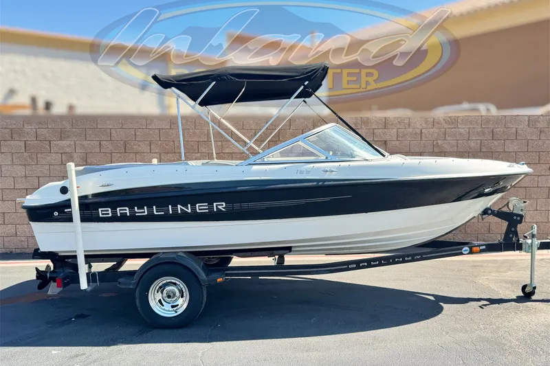 The Image of 2011 Bayliner 185 Bowrider boat on trailer, parked outdoors. - 0