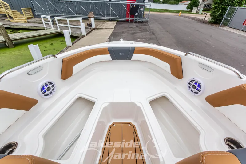 Slide: The Image of 2025 Chaparral 21 SSi boat interior with tan seating and speakers. - 35