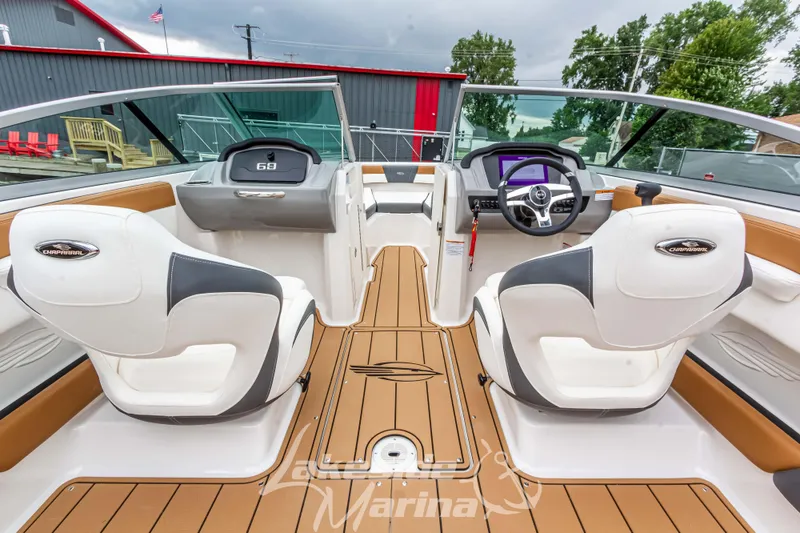 Slide: The Image of 2025 Chaparral 21 SSi boat interior with modern dashboard and seating. - 21