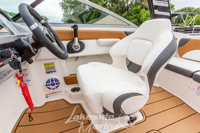 Slide: The Image of 2025 Chaparral 21 SSi boat interior with steering wheel and seating. - 26
