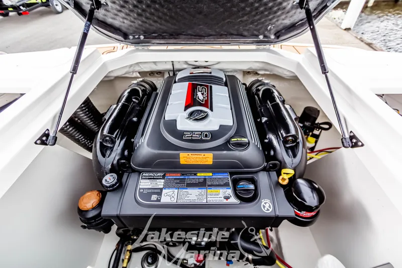 Slide: The Image of 2025 Chaparral 21 SSi boat engine compartment with Mercury 4.5L 250 HP engine. - 18