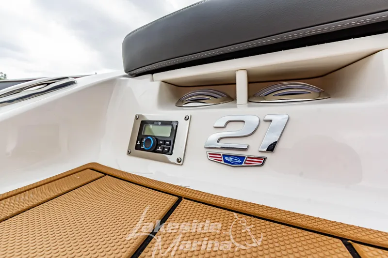 Slide: The Image of 2025 Chaparral 21 SSi boat deck with logo and control panel. - 10