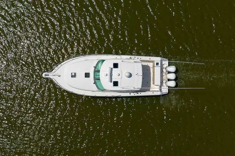 Slide: The Image of Aerial view of 2015 Pursuit OS 385 Offshore boat on water. - 2