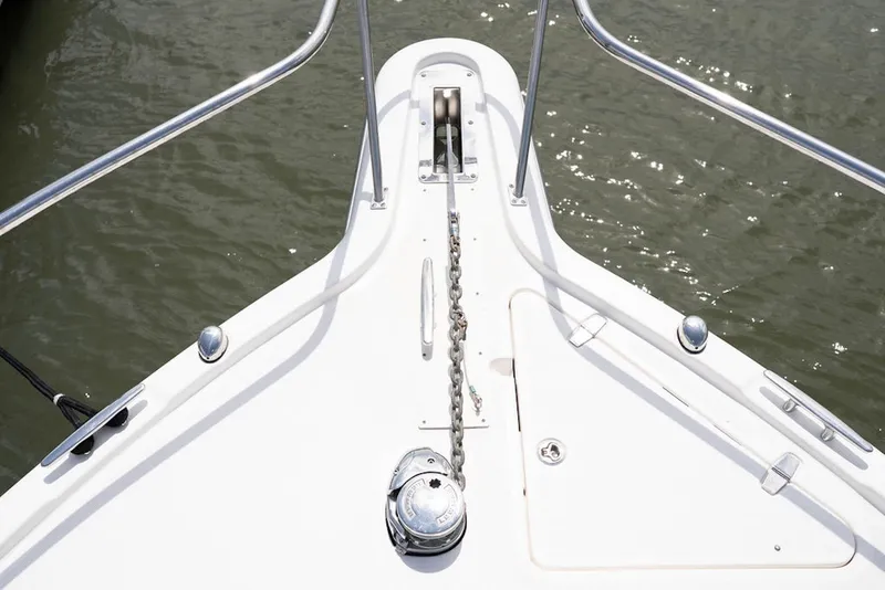 Slide: The Image of Bow of 2015 Pursuit OS 385 Offshore boat with anchor chain and railing. - 11