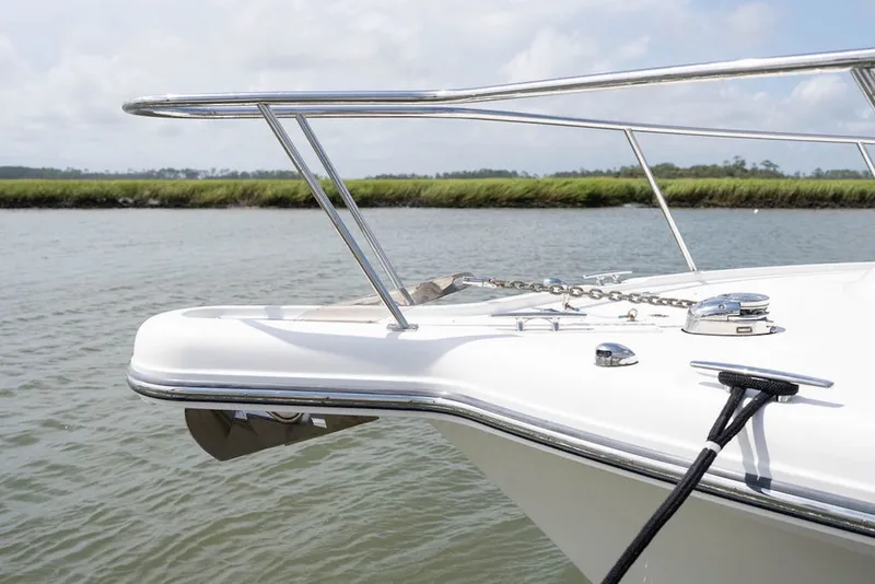 Slide: The Image of Bow of 2015 Pursuit OS 385 Offshore boat with railing and anchor chain. - 10