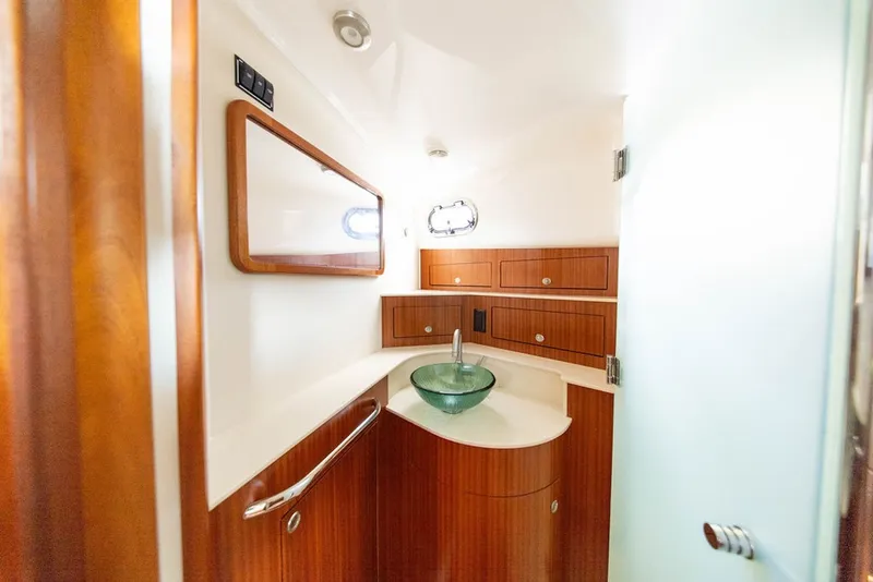 Slide: The Image of Luxurious bathroom interior of 2015 Pursuit OS 385 Offshore yacht with modern fixtures. - 32