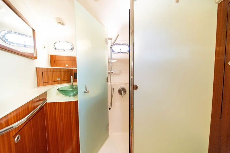Slide: The Image of Luxurious bathroom interior of 2015 Pursuit OS 385 Offshore yacht with modern fixtures. - 31
