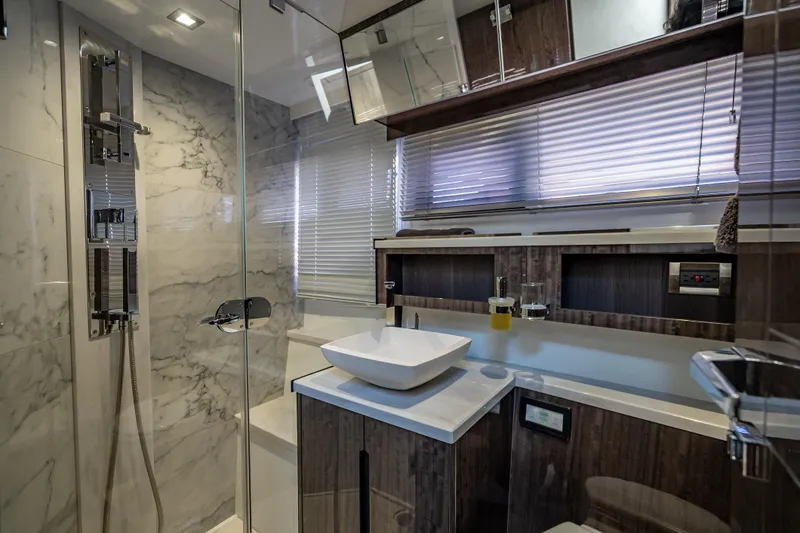 Slide: The Image of Luxurious bathroom in 2021 Galeon 500 Fly yacht with modern fixtures and marble accents. - 26