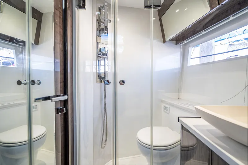 Slide: The Image of Modern bathroom in 2021 Galeon 500 Fly yacht with glass shower and sleek fixtures. - 24