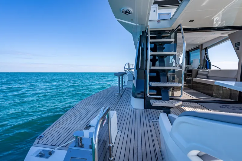 Slide: The Image of 2021 Galeon 500 Fly yacht deck with ocean view and modern interior. - 50