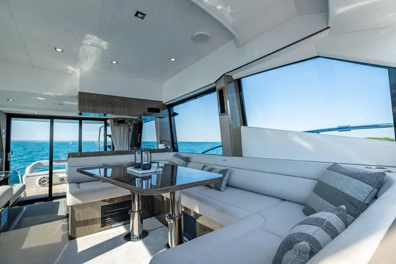 Slide: The Image of Interior of 2021 Galeon 500 Fly yacht with modern seating and ocean view. - 35