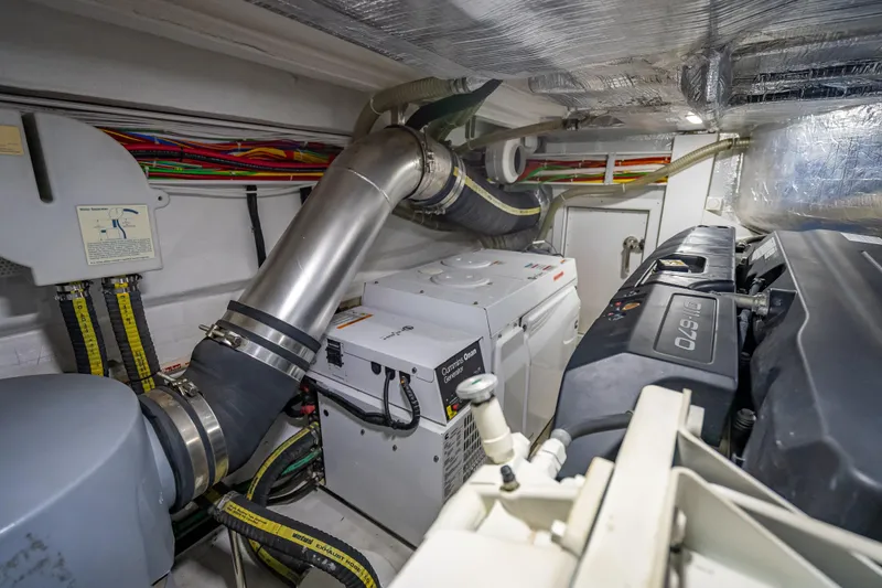 Slide: The Image of Engine room of 2021 Galeon 500 Fly yacht with Cummins Onan generator. - 57