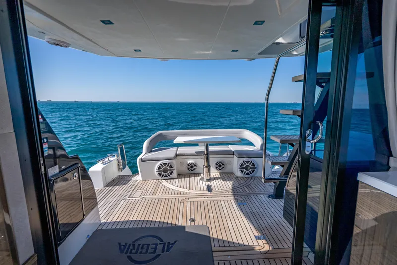 Slide: The Image of Galeon 500 Fly 2021 yacht deck with ocean view, featuring modern design and seating. - 49