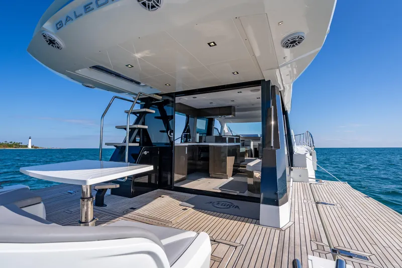 Slide: The Image of 2021 Galeon 500 Fly yacht with open deck, ocean view, and modern interior. - 52