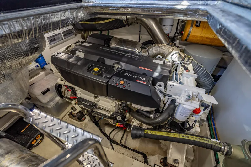 Slide: The Image of Engine room of 2021 Galeon 500 Fly yacht featuring Volvo Penta D11-670 engine. - 54