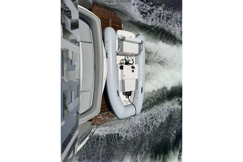 Slide: The Image of 2021 Galeon 500 Fly yacht with inflatable boat on water. - 67