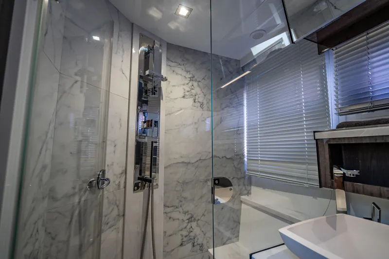 Slide: The Image of Luxurious bathroom with marble walls in 2021 Galeon 500 Fly yacht. - 27